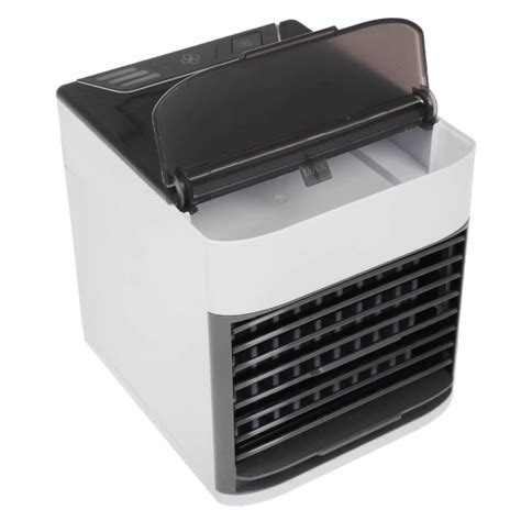 Kompaktný stolný ochladzovač vzduchu Domo umiestnený na pracovnom stole.