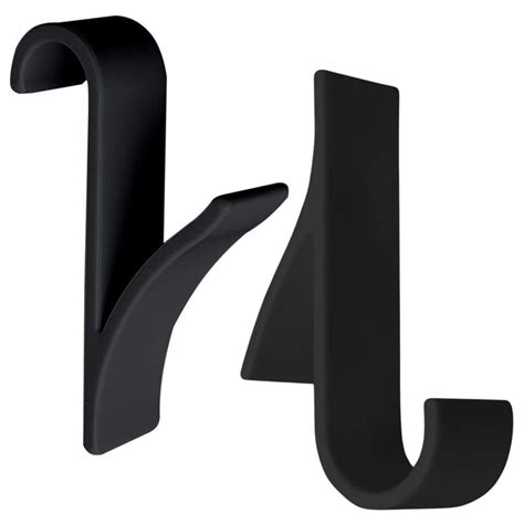 Rôzne typy držiakov na uteráky pre kúpeľňové radiátory, vrátane háčikov a magnetických držiakov.