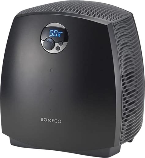 Schéma principu funkce zvlhčovače vzduchu Boneco 2055D s vyobrazením zvlhčovacích disků a ionizační tyčinky.