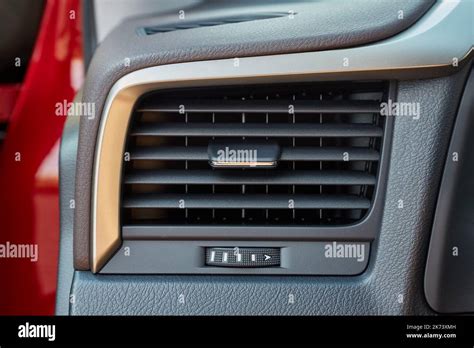 Thematic photo of a car dashboard with AC vents